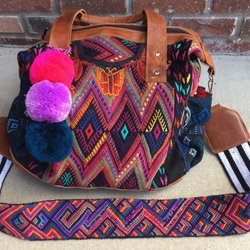 Nena & Co - A convertible day bag, triple pom, and camera strap. The craftsmanship is incredible.