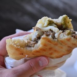 Rico Arepa - Arepa de pernil (slow roasted pork leg). Tender, tasty, and absolutely delicious.