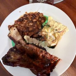 Ribs, potato salad, and baked beans. Ribs, potato salad, and baked beans.