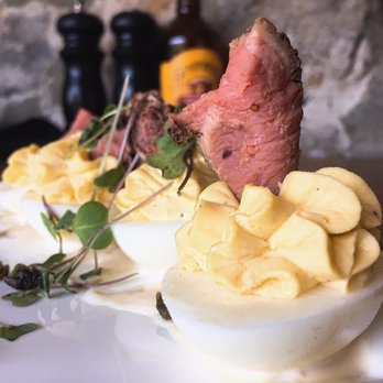 Tarpy's Roadhouse - Steak & Eggs: Deviled eggs, rare steak, fried capers, truffle aioli | $9 - New American Near Me - Monterey, California Tarpy's Roadhouse - Steak & Eggs: Deviled eggs, rare steak, fried capers, truffle aioli | $9 - New American Near Me - Monterey, California