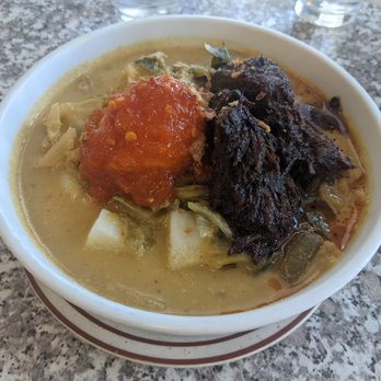 Toko Rame Indonesian Restaurant - #20 Lontong Sayur Padang (rice cakes with jackfruit curry, beef rendang, and spicy egg). - Indonesian Near Me - Bellflower, California Toko Rame Indonesian Restaurant - #20 Lontong Sayur Padang (rice cakes with jackfruit curry, beef rendang, and spicy egg). - Indonesian Near Me - Bellflower, California