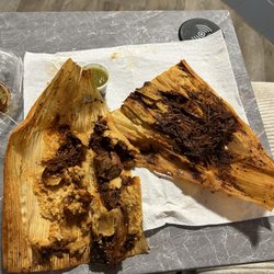 La Herradura Taqueria y Pupuseria - Pork tamales... 5-16-25 There stuck to the horn husks maybe because I left them in the foil for too long? Idk won't order these again tho