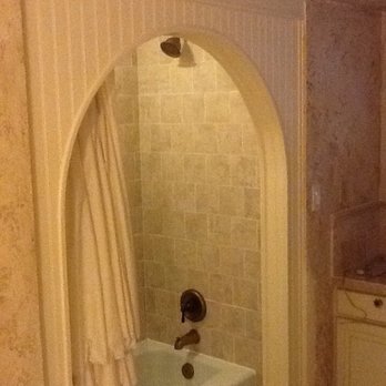 Mindful Remodel - 100% remodeled shower, custom built archway and tiled shower with new fixtures and tub. - General Contractors Near Me