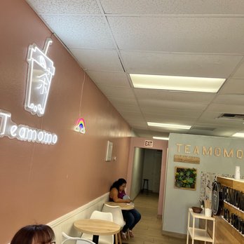 Tea Momo - a woman sitting at a table - Bubble Tea Near Me - Cathedral City, California Tea Momo - a woman sitting at a table - Bubble Tea Near Me - Cathedral City, California