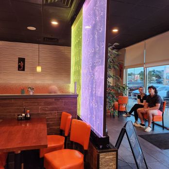 Red Ginger Asian Bistro - two people sitting at a table - Sushi Bars Near Me - Lake City, Florida Red Ginger Asian Bistro - two people sitting at a table - Sushi Bars Near Me - Lake City, Florida