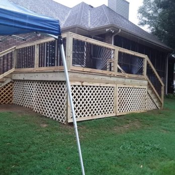 Round the House Services - New deck built with lattice underpinning and black aluminum spindles for the handrail with a sunburst pattern! - Decks & Railing Near Me Round the House Services - New deck built with lattice underpinning and black aluminum spindles for the handrail with a sunburst pattern! - Decks & Railing Near Me