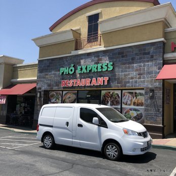 Pho Express - a white van parked in front of a restaurant - Vietnamese Near Me Pho Express - a white van parked in front of a restaurant - Vietnamese Near Me