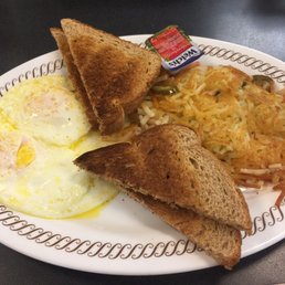 Eggs, toast and hash browns with jalapeño and tomato Eggs, toast and hash browns with jalapeño and tomato