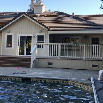 Devine Construction - Our new deck, with skirting to match the siding on our house. - General Contractors Near Me