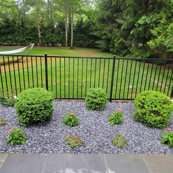 Quick Solution Property Care - a backyard with a hot tub - Landscaping Near Me