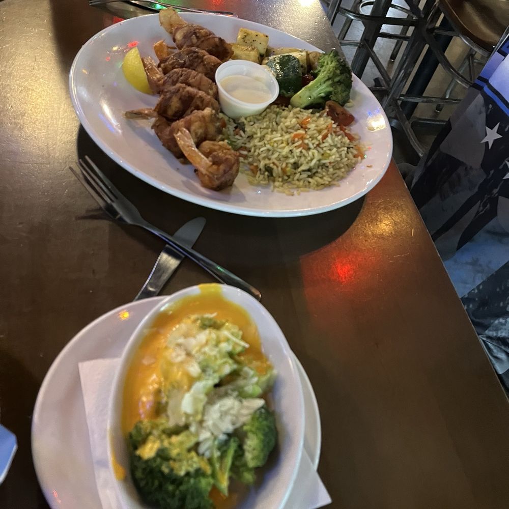Bacon wrapped stuffed shrimp with side of broccoli and cheese. Bacon wrapped stuffed shrimp with side of broccoli and cheese.