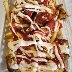 Kottu King - Chicken on Fries - Chef's Special spices mixed with chopped grilled chicken or crispy chicken and sauces on fries