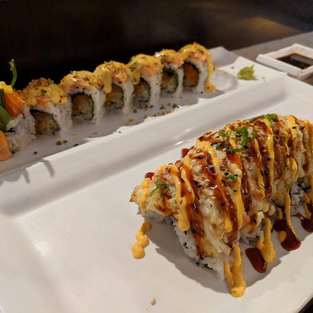 Chihiro Sushi & Bar - On top: Torched salmon (my favorite) On bottom: Volcano - Sushi Bars Near Me - Euless, Texas Chihiro Sushi & Bar - On top: Torched salmon (my favorite) On bottom: Volcano - Sushi Bars Near Me - Euless, Texas