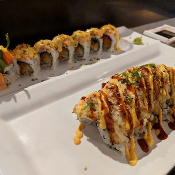 Chihiro Sushi & Bar - On top: Torched salmon (my favorite) On bottom: Volcano - Sushi Bars Near Me - Euless, Texas Chihiro Sushi & Bar - On top: Torched salmon (my favorite) On bottom: Volcano - Sushi Bars Near Me - Euless, Texas