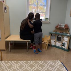 Tichenor Orthopedic Clinic For Children - Champion feeling secure and safe with his speech therapist in an environment with people who understand.