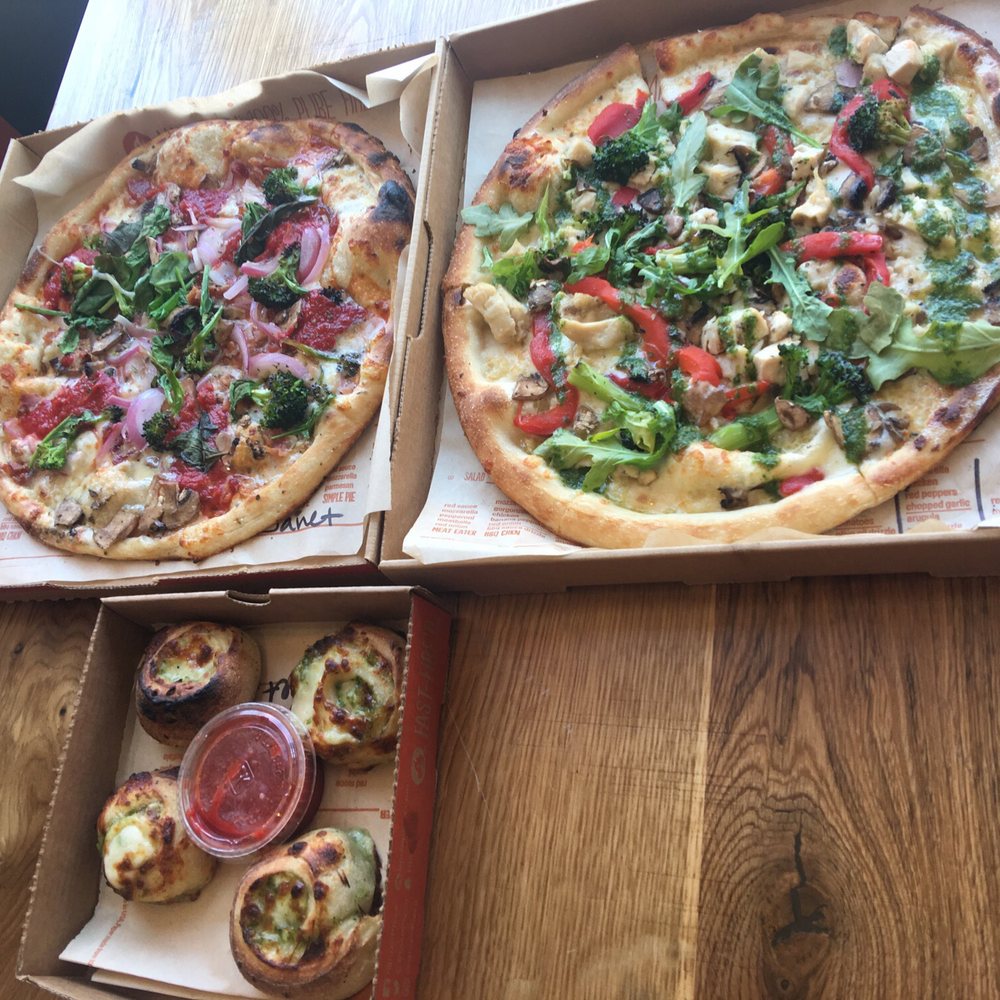 Blaze Pizza - Top left is Veg Out pizza with added ingredients and right is the Green Stripe with added broccoli. Bottom are the garlic knots (not free). - Pizza Near Me - Fresh Meadows, New York Blaze Pizza - Top left is Veg Out pizza with added ingredients and right is the Green Stripe with added broccoli. Bottom are the garlic knots (not free). - Pizza Near Me - Fresh Meadows, New York
