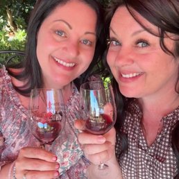 Sitting by the live music under a beautiful shade tree enjoying some fabulous wine!