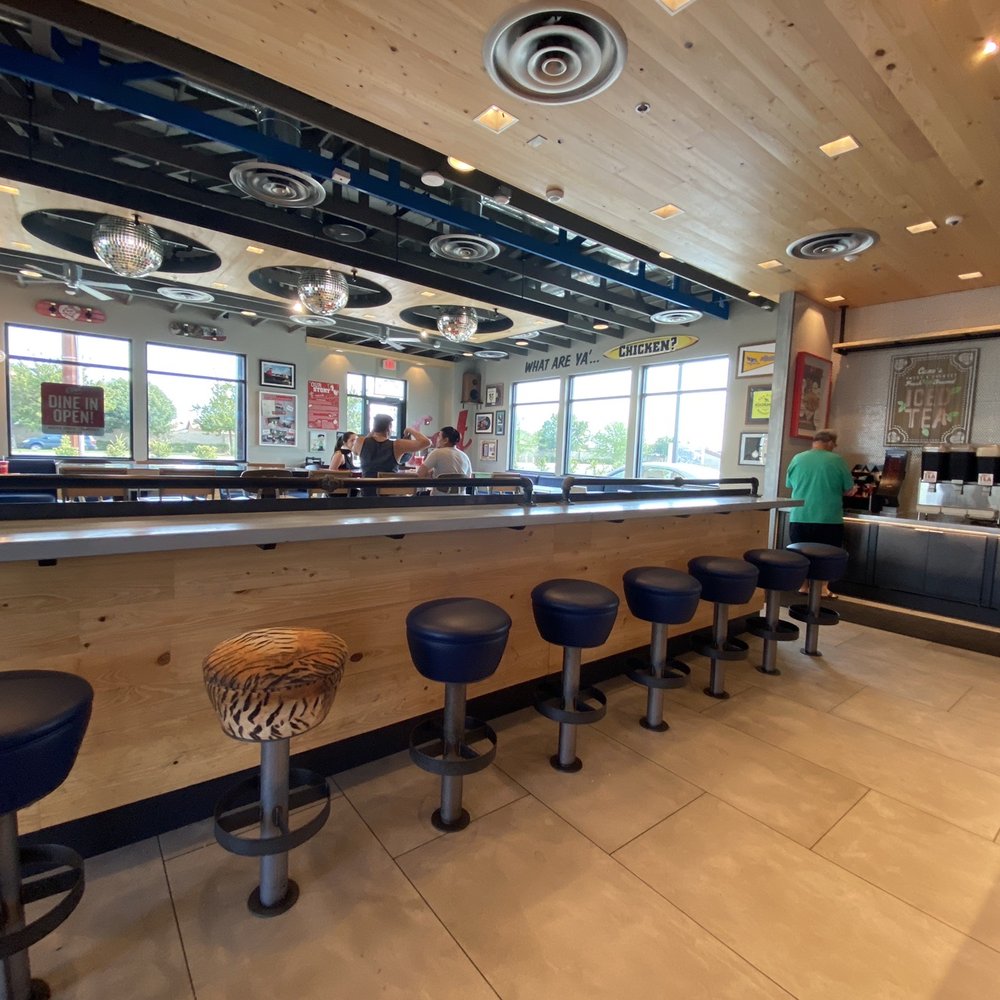 Raising Cane's Chicken Fingers - bar seating - Chicken Shop Near Me - Bakersfield, California Raising Cane's Chicken Fingers - bar seating - Chicken Shop Near Me - Bakersfield, California