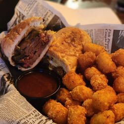 Roaming Bison Tavern - BBQ Philly dip. Smoked Brisket, Peppers,  onions home made cheese sauce with BBQ Au jus
