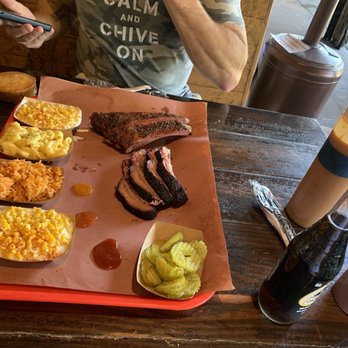 Terry Black's Barbecue - Brisket and pork ribs. Sides are cornbread, creamed corn x 2, Mac and cheese. Drinks are Karbach Hopadillo IPA and a Mexican Coke. - Barbeque Near Me - Austin, Texas Terry Black's Barbecue - Brisket and pork ribs. Sides are cornbread, creamed corn x 2, Mac and cheese. Drinks are Karbach Hopadillo IPA and a Mexican Coke. - Barbeque Near Me - Austin, Texas
