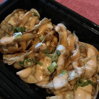 Thai Lada - Dumplings. Had a creamy sauce on top and another sauce on the bottom. - Thai Near Me - Austin, Texas