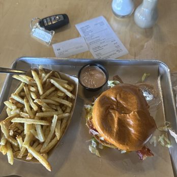 Rockin Rollerz Craft Burger - Future Chicken burger, medium. Regular fries (they are huge!) and a sauce which I'm not allowed to disclose (it totally smokes ketchup). - Burgers Near Me - Abilene, Texas Rockin Rollerz Craft Burger - Future Chicken burger, medium. Regular fries (they are huge!) and a sauce which I'm not allowed to disclose (it totally smokes ketchup). - Burgers Near Me - Abilene, Texas