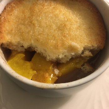 Hilton Atlanta - Inside of the room service peach cobbler. It was okay. Although the topping is basically white cake instead of pie crust. - Hotels Near Me - Atlanta, Georgia Hilton Atlanta - Inside of the room service peach cobbler. It was okay. Although the topping is basically white cake instead of pie crust. - Hotels Near Me - Atlanta, Georgia