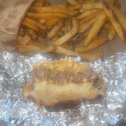 Grill cheese, with a meat patty and grilled onions. With Cajun fries. Grill cheese, with a meat patty and grilled onions. With Cajun fries.
