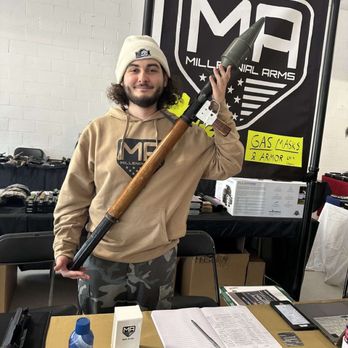Millennial Arms LLC - Millennial Arms staff holding an RPG at a gun show in Murfreesboro, TN - Guns & Ammo Near Me - Nashville, Tennessee Millennial Arms LLC - Millennial Arms staff holding an RPG at a gun show in Murfreesboro, TN - Guns & Ammo Near Me - Nashville, Tennessee