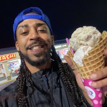 Baskin Robbins - a man holding an ice cream cone - Ice Cream & Frozen Yogurt Near Me - Hampton, Virginia