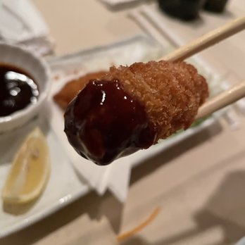 Mr Sushi Japanese Restaurant - a close up of a fried donut on a stick - Japanese Near Me - Dallas, Texas Mr Sushi Japanese Restaurant - a close up of a fried donut on a stick - Japanese Near Me - Dallas, Texas
