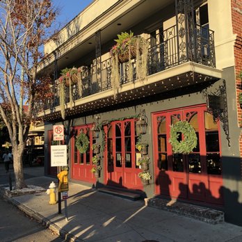 Anson - the front of a building with red doors and balconies - Seafood Near Me - Charleston, South Carolina Anson - the front of a building with red doors and balconies - Seafood Near Me - Charleston, South Carolina