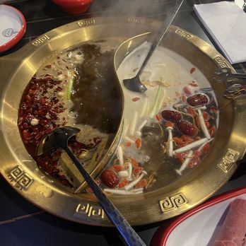 JoyPot - Hotpot: Spicy beef tallow (left), mushroom broth (right) - Hot Pot Near Me - Long Island City, New York