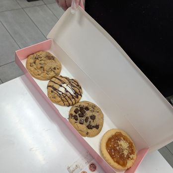 Crumbl - Sand Lake - Milk chocolate chip, s'mores, semi-sweet chocolate chip, apple pie cookie - Bakeries Near Me - Orlando, Florida