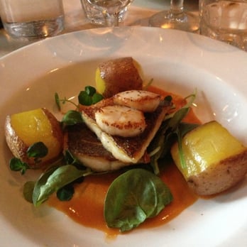 The Outsider - Fish filet with scallops, saffron cream, and potatoes - Modern European Near Me - Edinburgh, EDH The Outsider - Fish filet with scallops, saffron cream, and potatoes - Modern European Near Me - Edinburgh, EDH