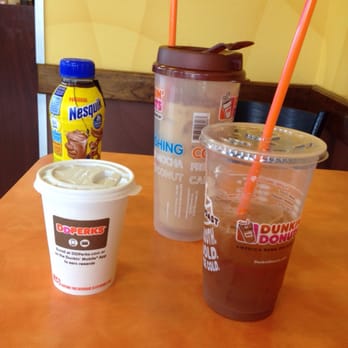 Dunkin' - two cups of coffee and a drink on a table - Donuts Near Me - Alexandria, Virginia Dunkin' - two cups of coffee and a drink on a table - Donuts Near Me - Alexandria, Virginia