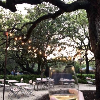 Mattie's - Outdoor patio under the trees. There were 3 peacocks above us in the branches. - American Near Me - Austin, Texas Mattie's - Outdoor patio under the trees. There were 3 peacocks above us in the branches. - American Near Me - Austin, Texas