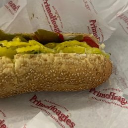 a hot dog with pickles and mustard a hot dog with pickles and mustard
