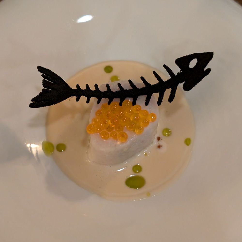 ADEGA Restaurant - Swordfish in white sauce, topped with steelhead trout roe, dotted with dill oil, garnished with a squid ink tile. - Portuguese Near Me - San Jose, California