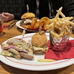 Cuban with Dill Fries (front), and a Brisket Sandwich with Onion Rings (back) Cuban with Dill Fries (front), and a Brisket Sandwich with Onion Rings (back)