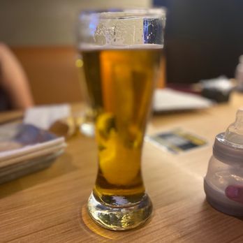 Buffalo Wild Wings - a glass of beer on a table - Chicken Wings Near Me - Killeen, Texas Buffalo Wild Wings - a glass of beer on a table - Chicken Wings Near Me - Killeen, Texas