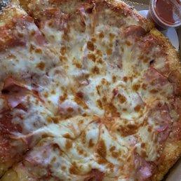 Extra cheese and ham pizza with extra pizza sauce and all of the crust toppings