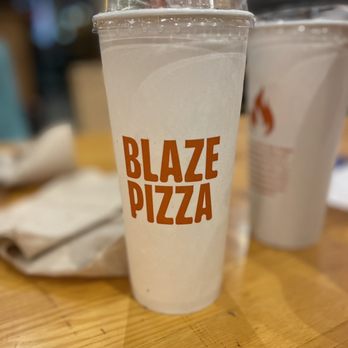 Blaze Pizza - two cups of pizza on a table - Pizza Near Me - Tampa, Florida Blaze Pizza - two cups of pizza on a table - Pizza Near Me - Tampa, Florida