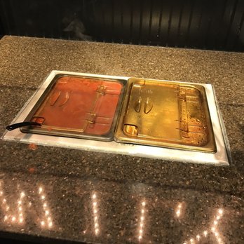 Monical's Pizza - two trays of food on a counter - Pizza Near Me - Clinton, Illinois Monical's Pizza - two trays of food on a counter - Pizza Near Me - Clinton, Illinois