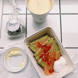 Shot - Avo toast with poached egg and salmon. Raw ball bites. Turmeric oat milk latte.  Everything 11/10. Turmeric latte was SO CREAMY.