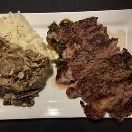 Steak, mashed potatoes and mushrooms. Would be so much prettier if plated as advertised. But taste was good!