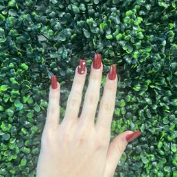 Red, medium length, coffin shape nails with white hearts