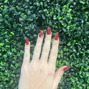 QN Nails - Red, medium length, coffin shape nails with white hearts - Nail Salons Near Me - Austin, Texas