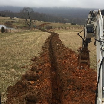 Jose Landscaping - Making hole to put a water line - Landscaping Near Me - Stephens City, Virginia Jose Landscaping - Making hole to put a water line - Landscaping Near Me - Stephens City, Virginia