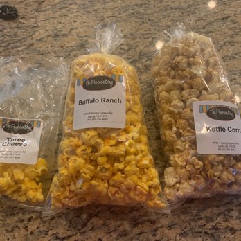 The Popcorn Bag - three bags of popcorn sitting on a counter - Popcorn Shops Near Me - Spring, Texas The Popcorn Bag - three bags of popcorn sitting on a counter - Popcorn Shops Near Me - Spring, Texas